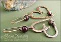 Antiqued copper and garnet wire wrapped heart earrings