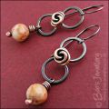 Oxidised figure of 8 copper earrings with rosebud knot