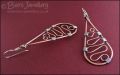 Teardrop earrings filled with squiggles wrapped with silver