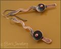 Antiqued copper squiggle earrings with a bud and flower
