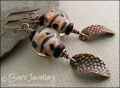 Spotted glass bead and copper charm earrings
