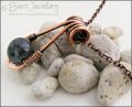 Antiqued copper necklace featuring a teardrop shaped pendant