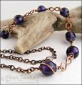 Purple glass bead necklace with copper hammered figure of 8 links