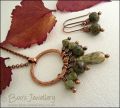 Necklace and earring set featuring a hammered circle wrapped with earthy beads