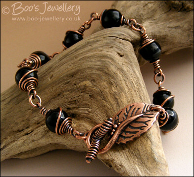 Copper and onyx wire wrapped bracelet with leaf toggle clasp