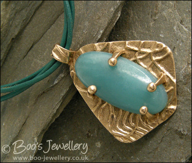 Bronze and Amazonite pendant on leather