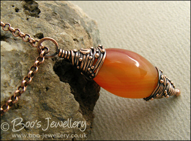 Carnelian and decorative bead cap pendant on chain
