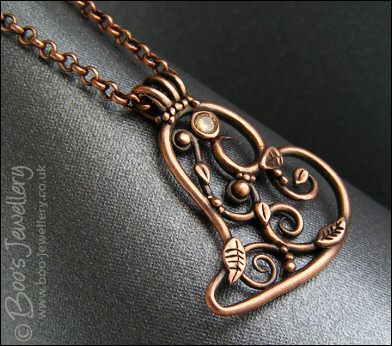 Filigree heart pendant with Champagne CZ stone