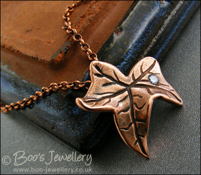 Copper ivy leaf pendant set with Cubic Zirconia raindrop