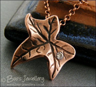 Copper ivy leaf pendant set with Cubic Zirconia raindrop