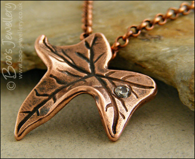 Copper ivy leaf pendant set with Cubic Zirconia raindrop