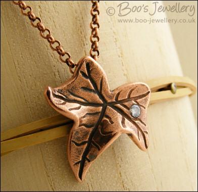 Copper ivy leaf pendant set with Cubic Zirconia raindrop