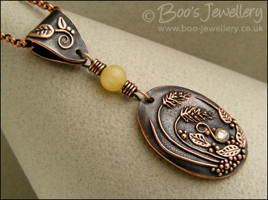 Copper and honey jade pendant with leaves and grasses