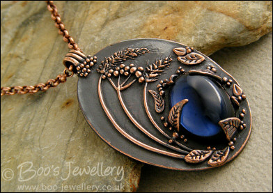 Midnight scene pendant with deep blue cabochon