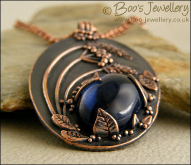Midnight scene pendant with deep blue cabochon
