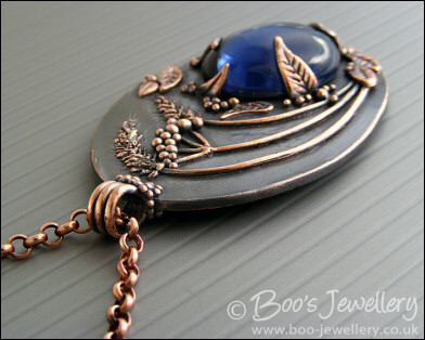 Midnight scene pendant with deep blue cabochon