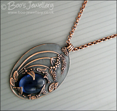 Midnight scene pendant with deep blue cabochon