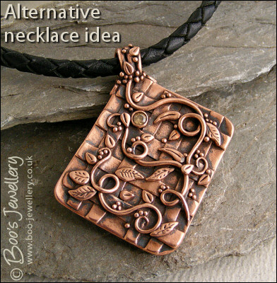 Copper garden trellis pendant festooned with vines and leaves