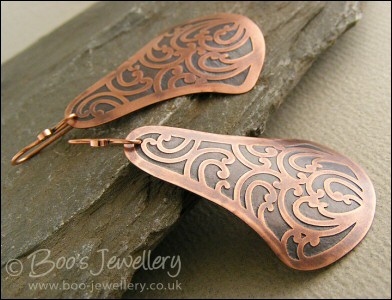Fan shaped etched copper earrings with scroll design