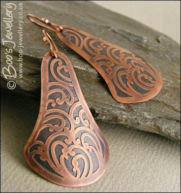 Fan shaped etched copper earrings with scroll design