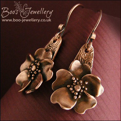 Wild rose hand sculpted copper earrings