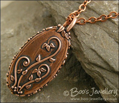 Faux green jade cabochon and leaf themed pendant