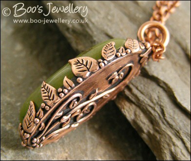 Faux green jade cabochon and leaf themed pendant