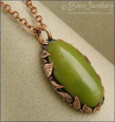 Faux green jade cabochon and leaf themed pendant