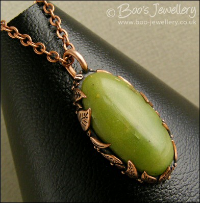 Faux green jade cabochon and leaf themed pendant