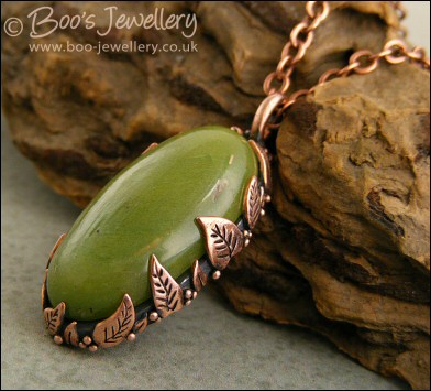 Faux green jade cabochon and leaf themed pendant