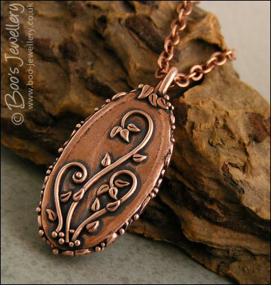 Faux green jade cabochon and leaf themed pendant
