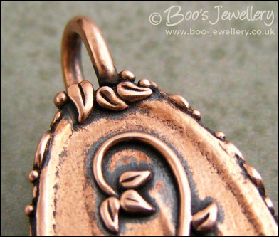 Faux green jade cabochon and leaf themed pendant