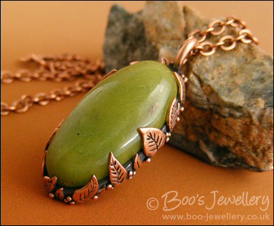Faux green jade cabochon and leaf themed pendant