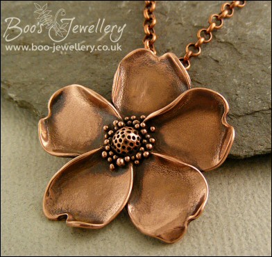 Solid copper hand sculpted wild rose pendant