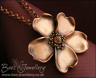 Solid copper hand sculpted wild rose pendant