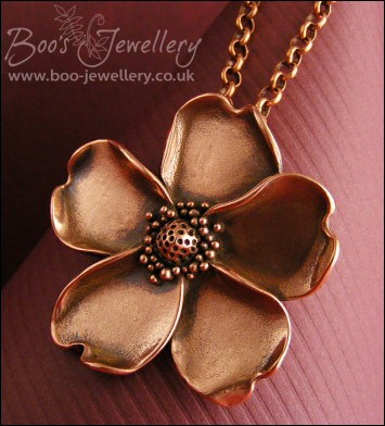 Solid copper hand sculpted wild rose pendant