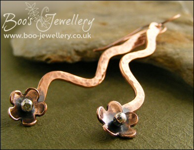Antiqued copper squiggle drop and flower earrings