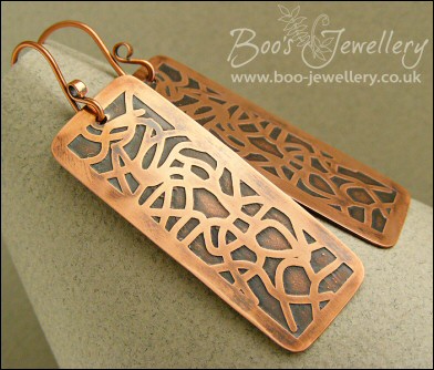 Etched copper earrings with random geometric design