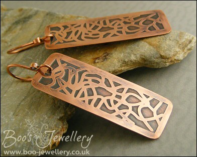 Etched copper earrings with random geometric design