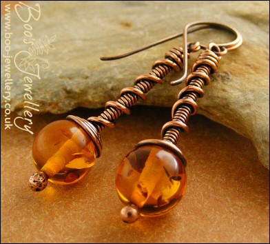 Faux amber coil on coil copper earrings