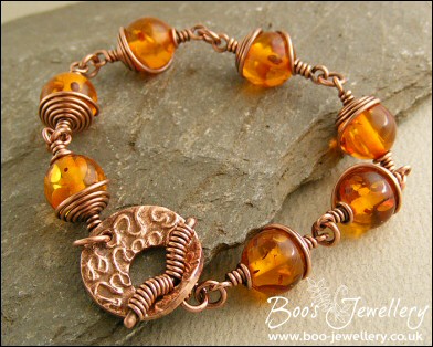 Faux amber and spiral wrapped copper toggle bracelet.