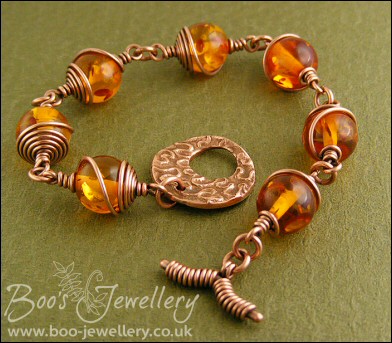 Faux amber and spiral wrapped copper toggle bracelet.