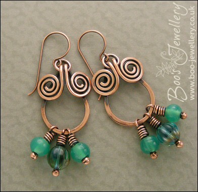 Copper spiral chandelier earrings with turquoise glass dangles