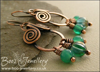 Copper spiral chandelier earrings with turquoise glass dangles