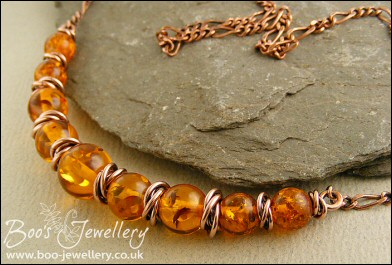 Faux amber and copper necklace with mobius ring separators - made to order