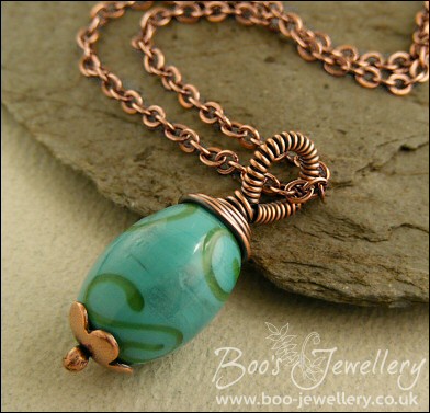 Turquoise glass and copper wire wrapped pendant on chain