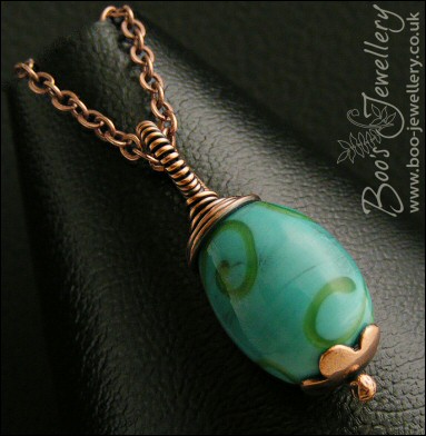 Turquoise glass and copper wire wrapped pendant on chain