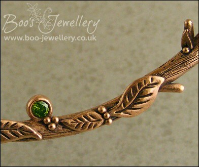 Hand sculpted twig and leaf necklace with silver blossoms