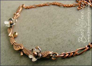 Hand sculpted twig and leaf necklace with silver blossoms