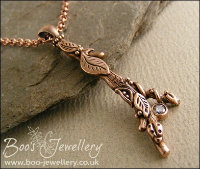 Hand sculpted twig pendant set with cubic zirconium gemstone
